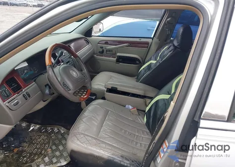 2003 Lincoln Town Car Signature z USA, uszkodzony, nr VIN 1LNHM82W23Y604044